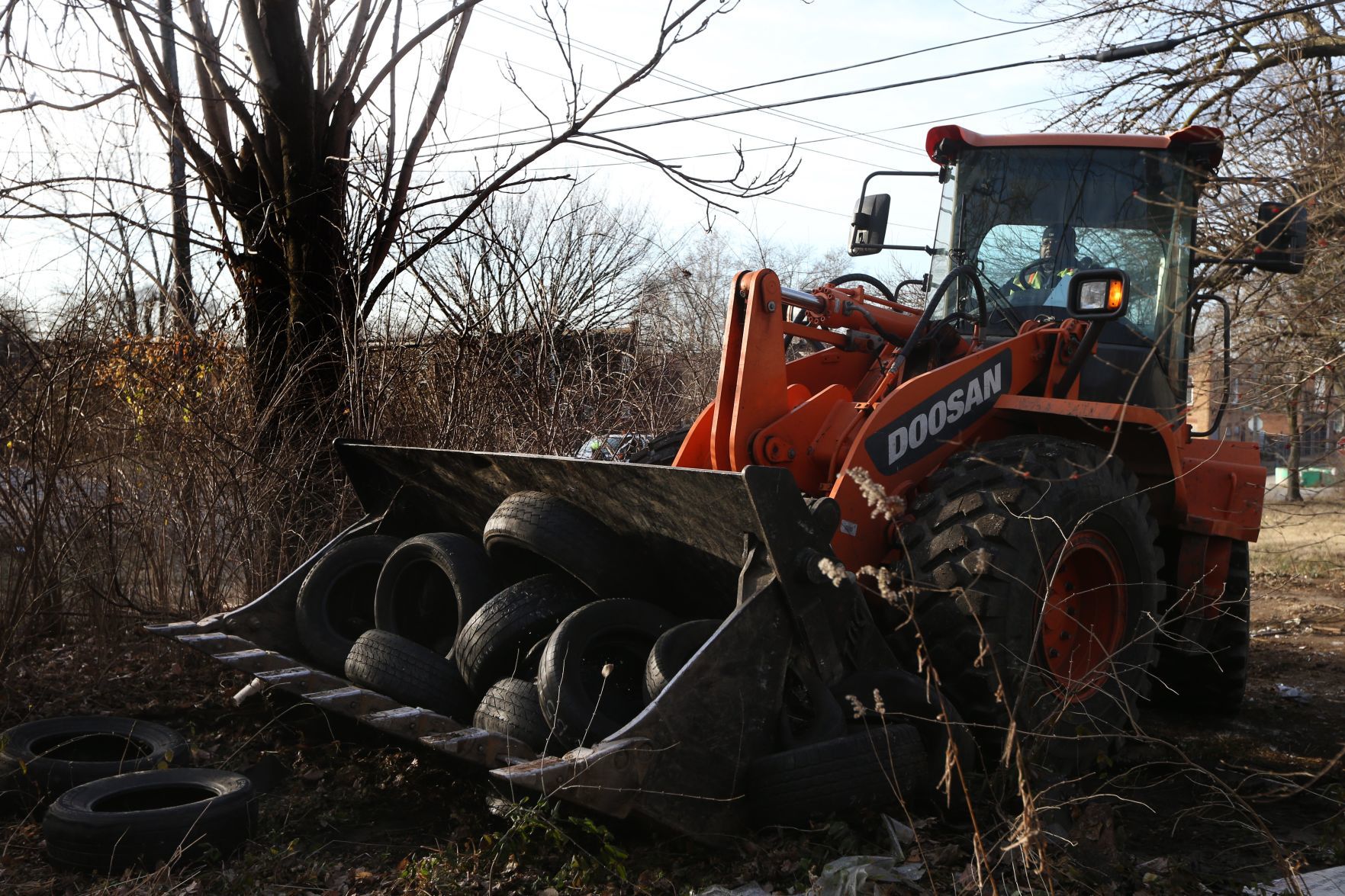 Broderick Young cleans up illegally dumped tires